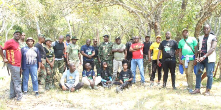 Hikers and Moyale in tree planting initiative